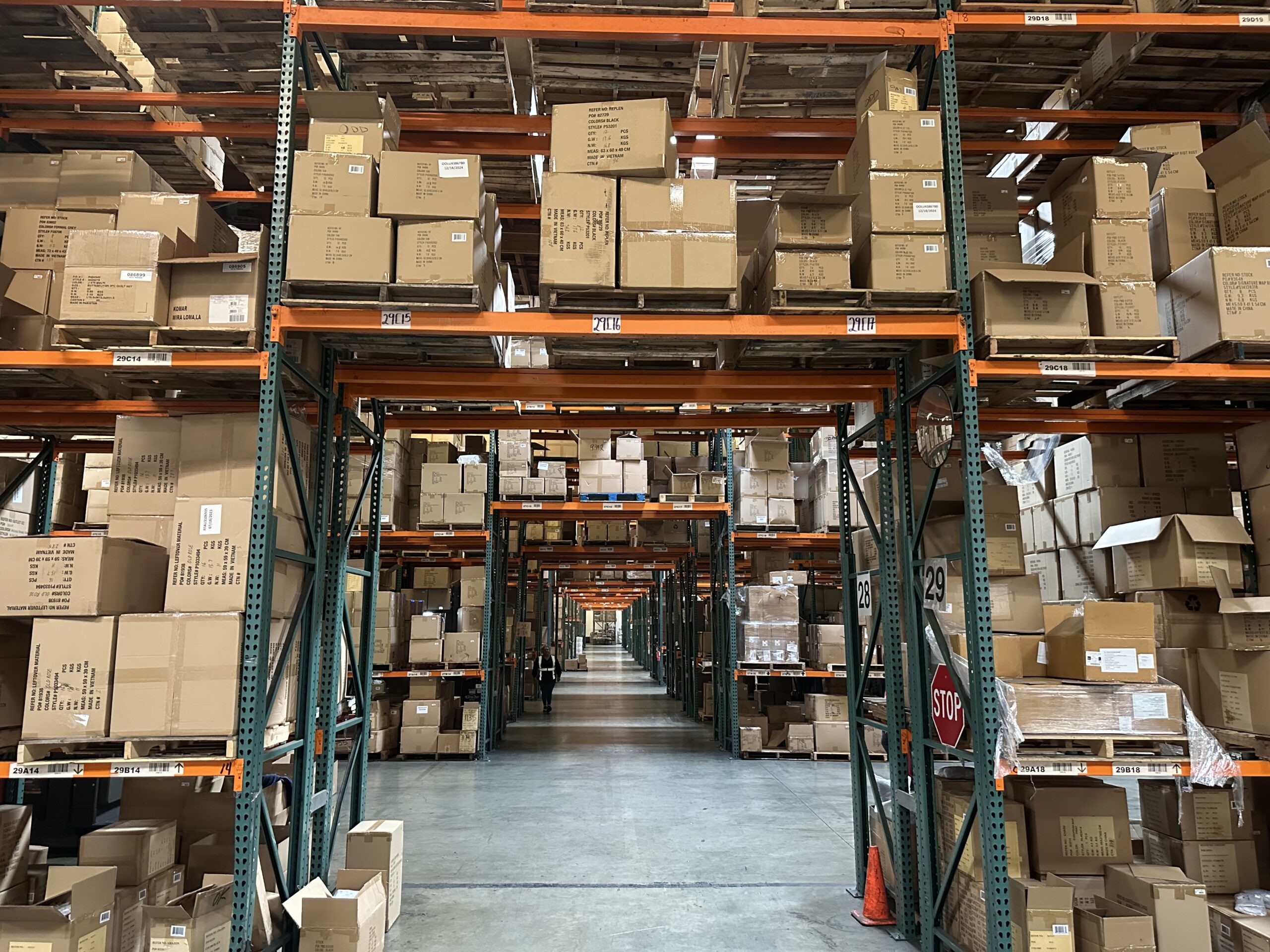 A warehouse filled with lots of boxes and shelves.